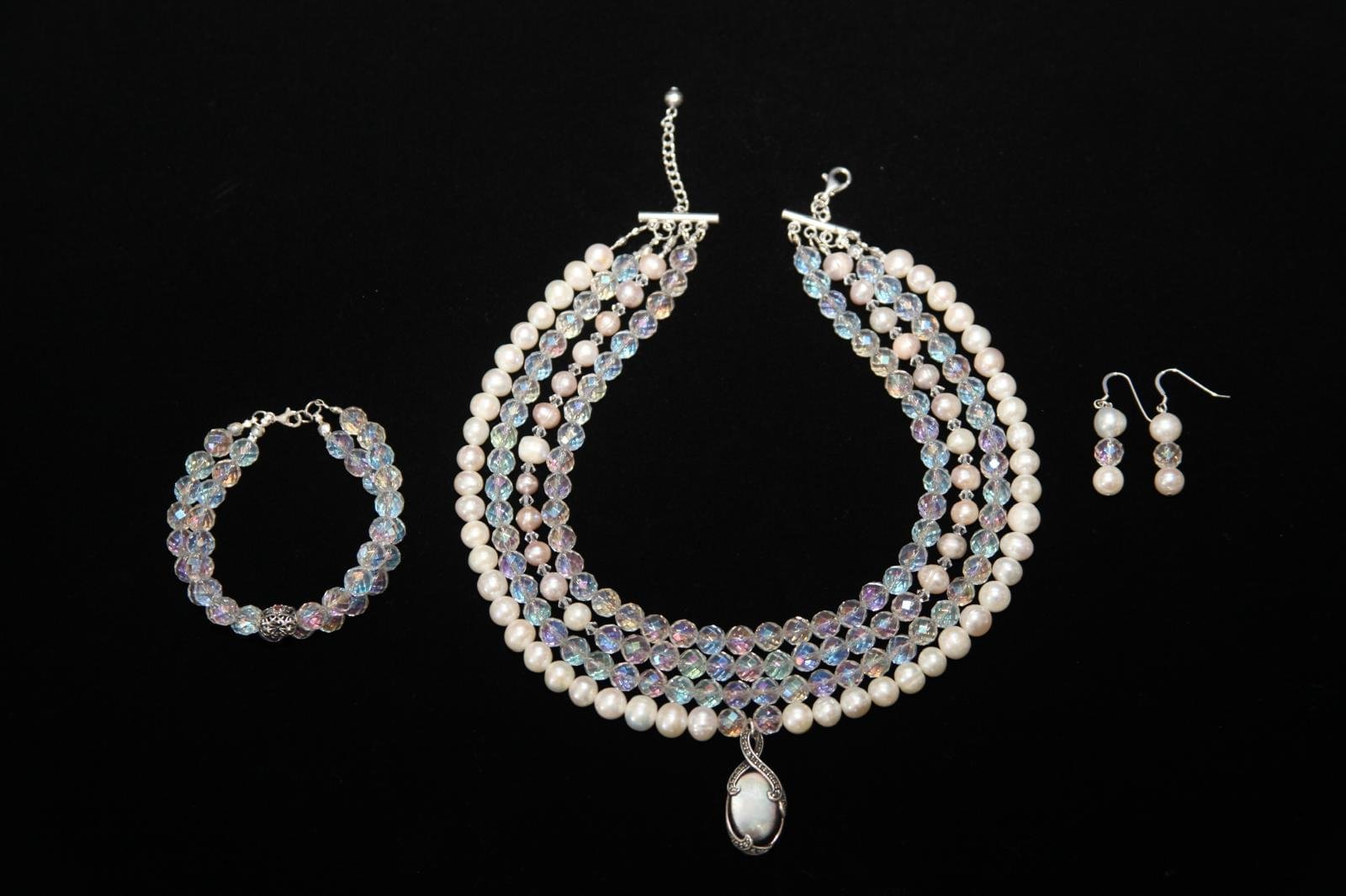Jewelry set featuring a multi-strand necklace, a bracelet, and drop earrings, each containing pearl and crystal beads - Perles Custom Jewelry NYC